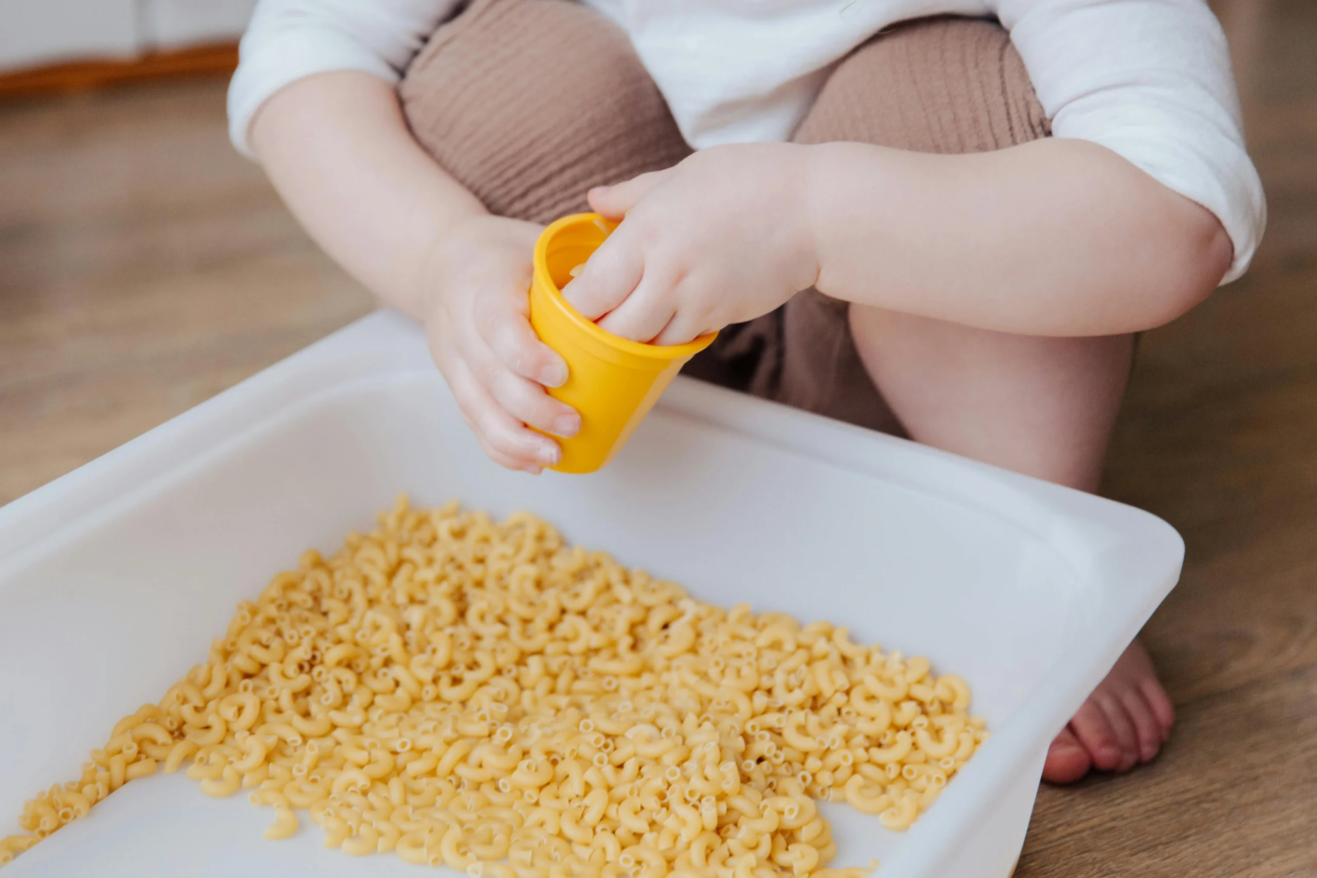 Child participating in a sensory activity, highlighting sensory play's role in spd awareness and exploring whether spd or autism is present. Child participating in a sensory activity, highlighting sensory play's role in spd awareness and exploring whether spd or autism is present.