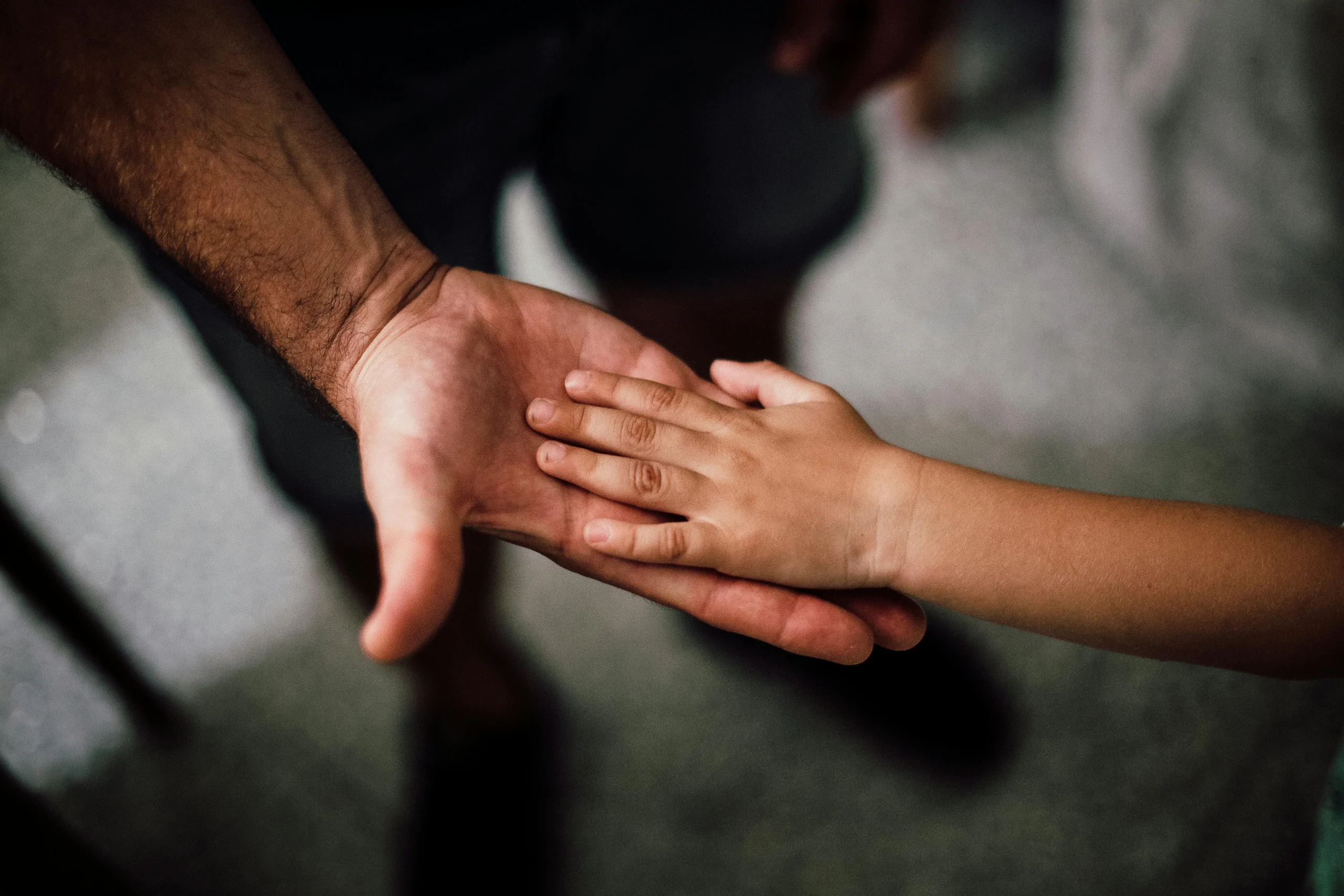Supportive interaction between a caregiver and child, emphasizing the difference between autism and spd and the value of seeking help from a special needs financial advisor spd vs autism