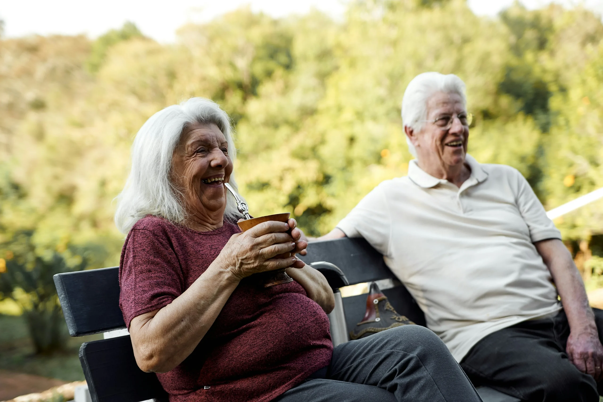 Advanced care planning elderly parents sharing a joyful moment outdoors, highlighting the importance of securing their future care needs.