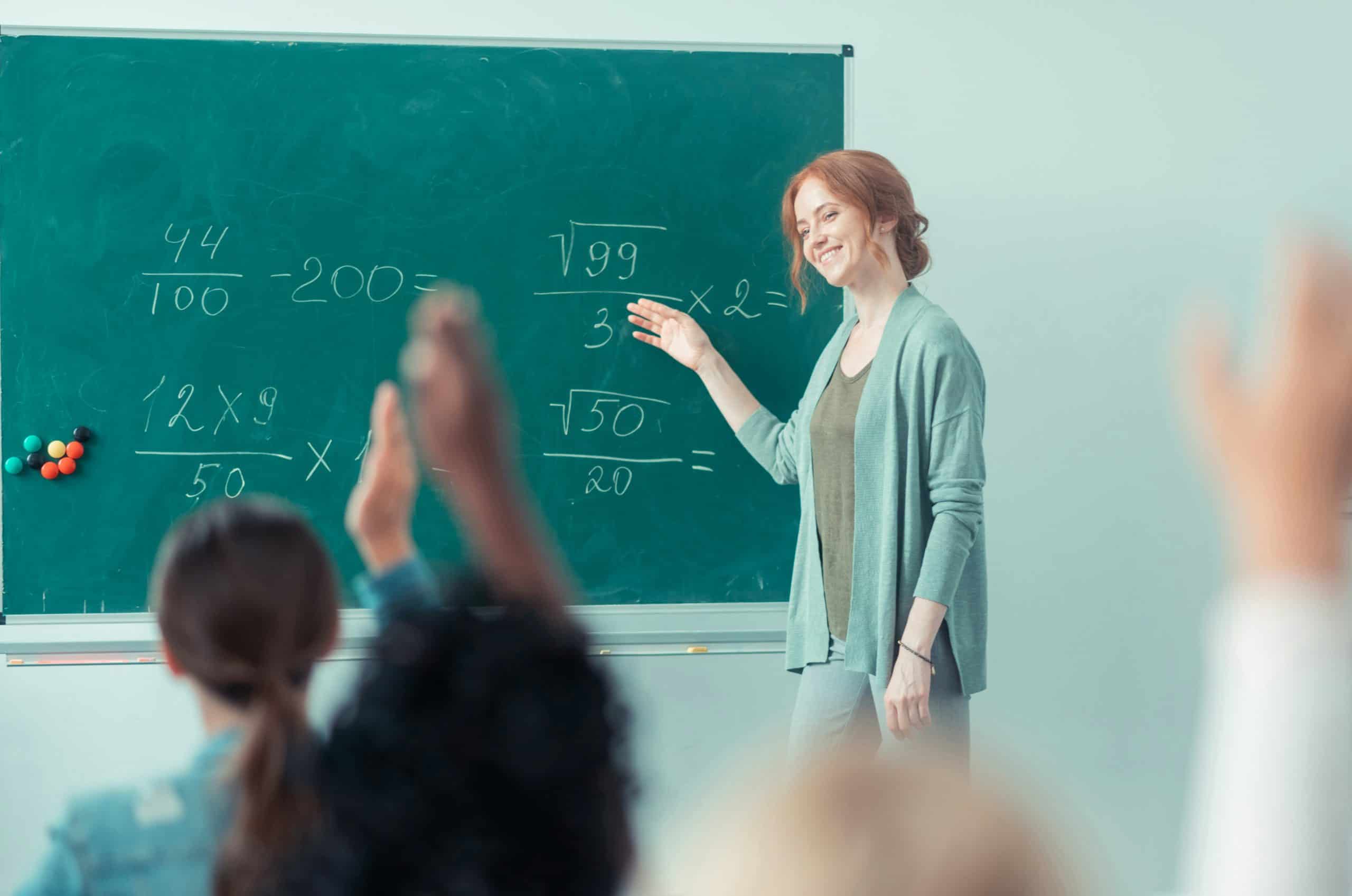 Teacher engaging students during a classroom math lesson, highlighting inclusive instruction supported by IEP and 504 accommodations Teacher engaging students during a classroom math lesson, highlighting inclusive instruction supported by IEP and 504 accommodations