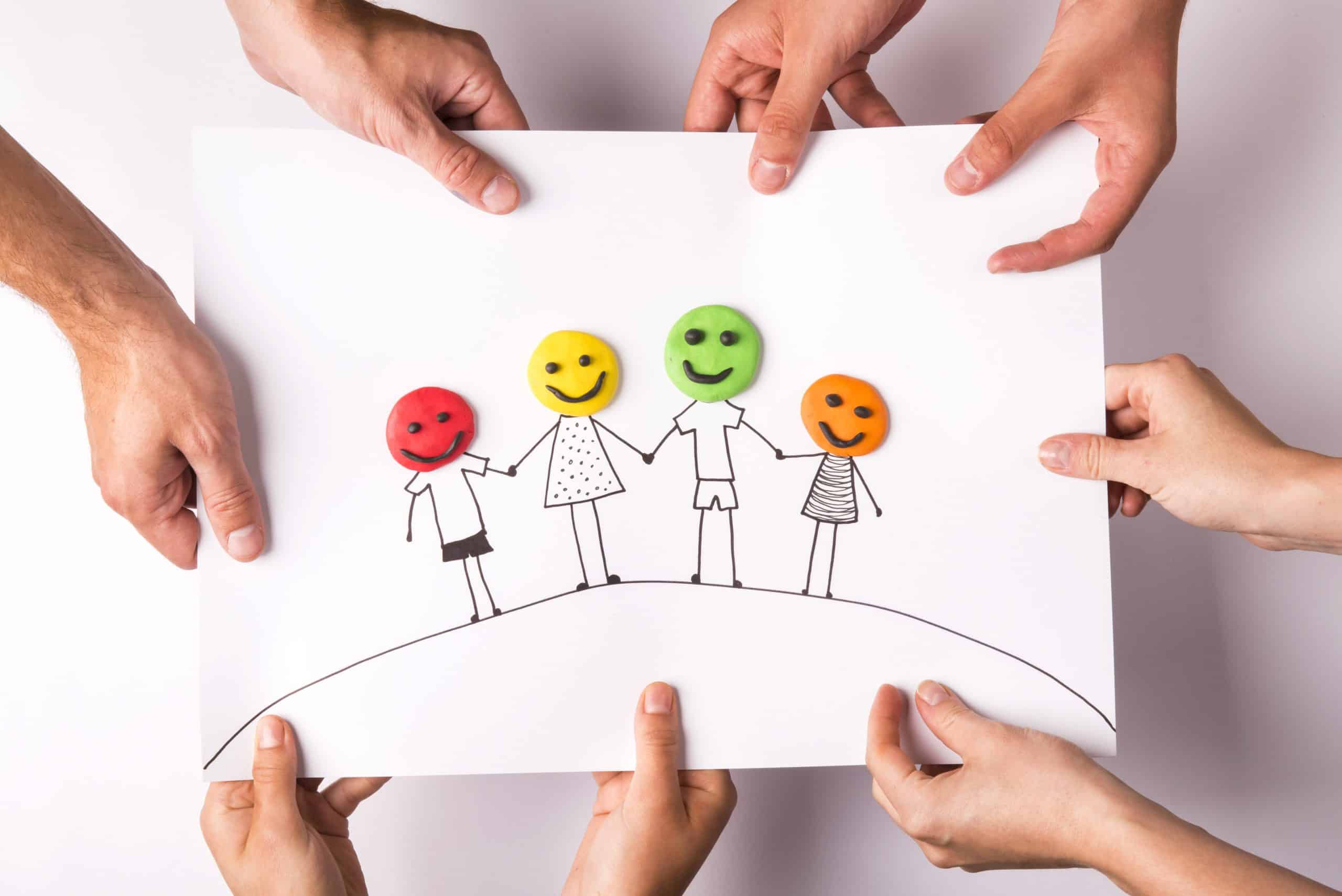 Family concept Guardianship for Special Needs Happy family concept with heads from play dough