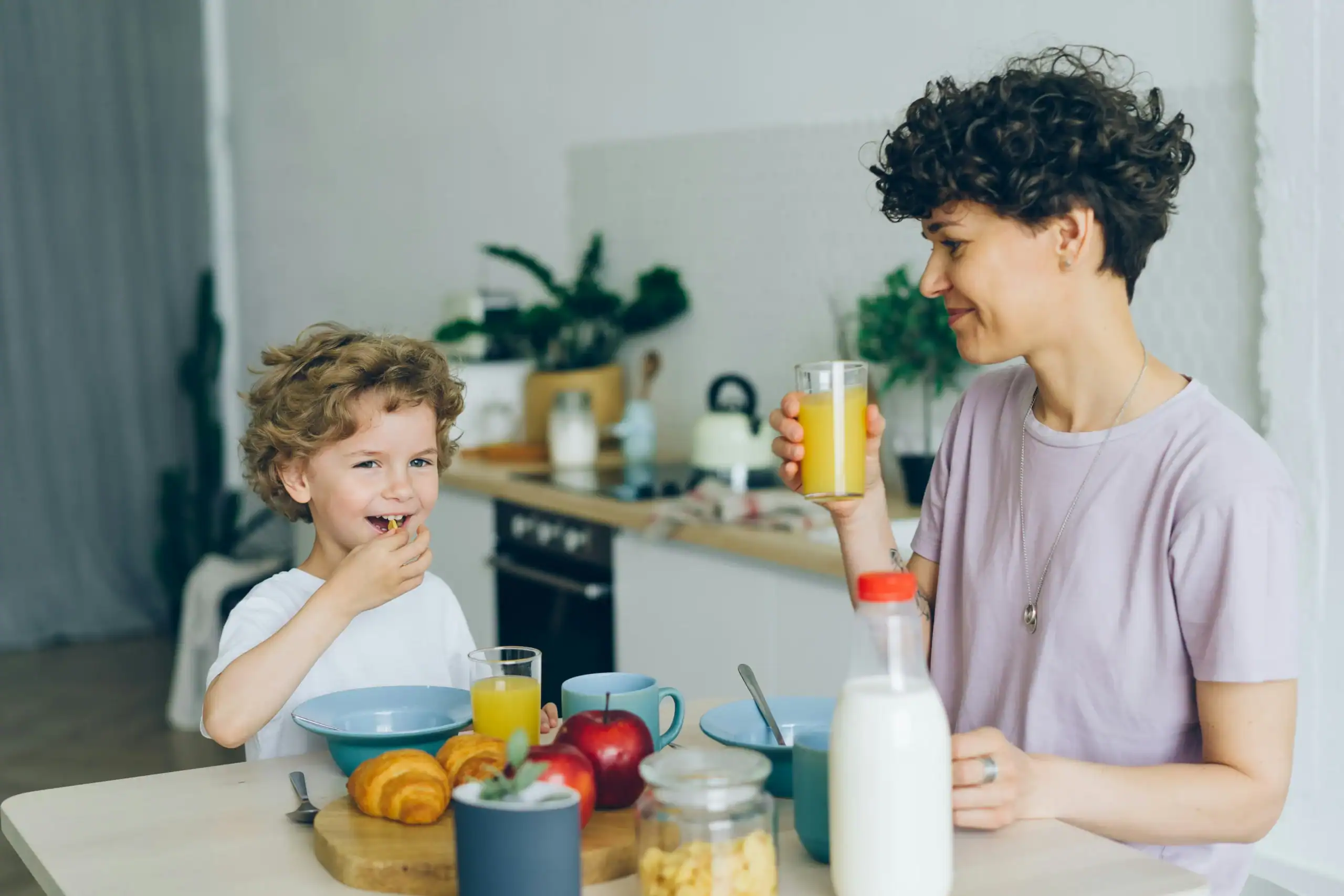 Mother and child enjoying breakfast together, highlighting sensory-related types of ARFID