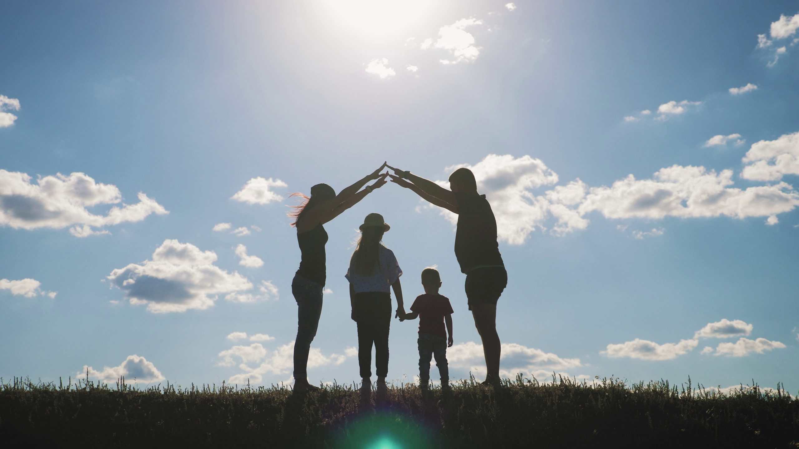When Love Overcomes Judgment - a-silhouette-happy-young-family-at-sunset-father-mother-and-two-children-building-a-home