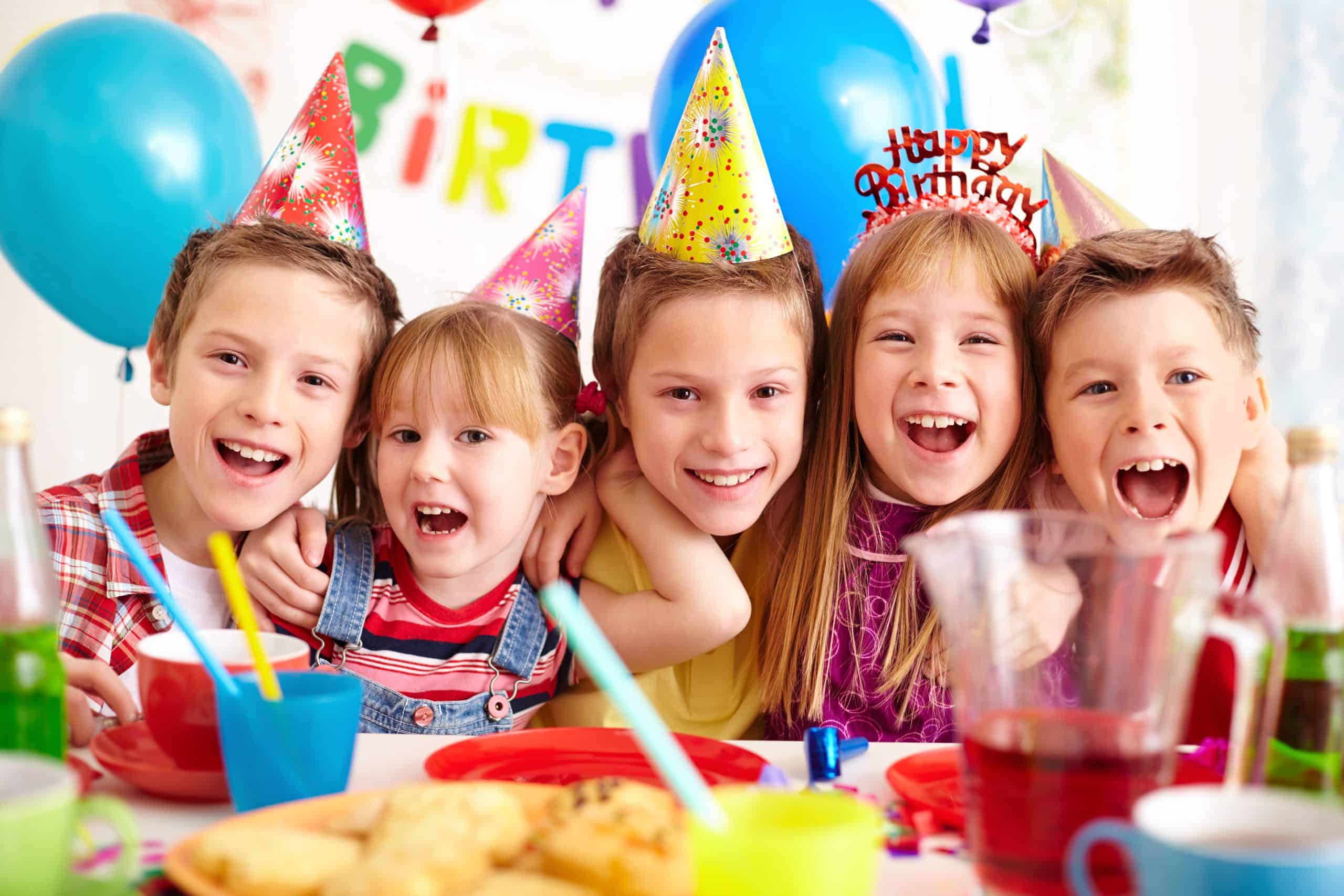 Group of friends Group of adorable kids looking at camera at birthday party