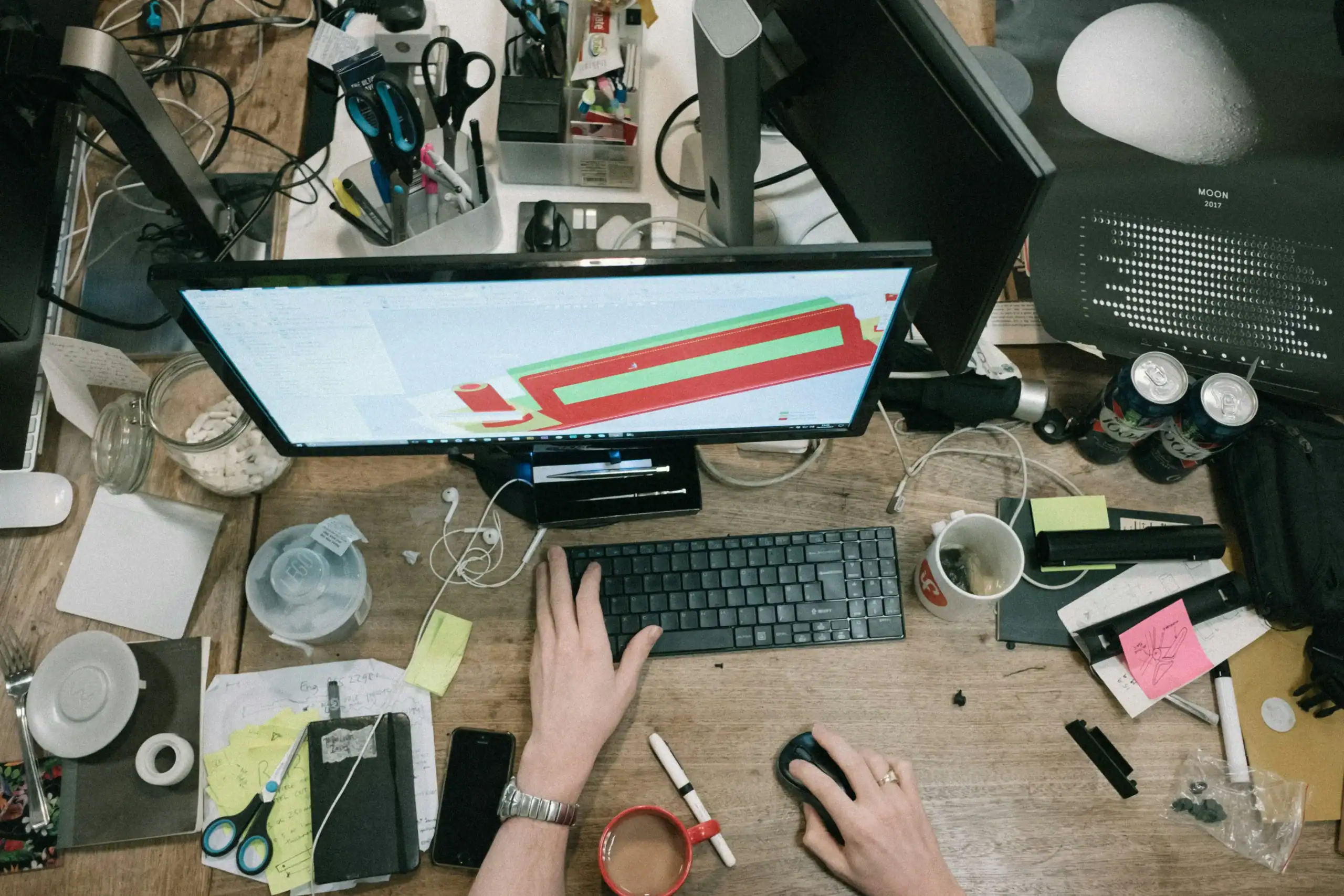 Cluttered workspace demonstrating the need for organization tips for focusing with ADHD.