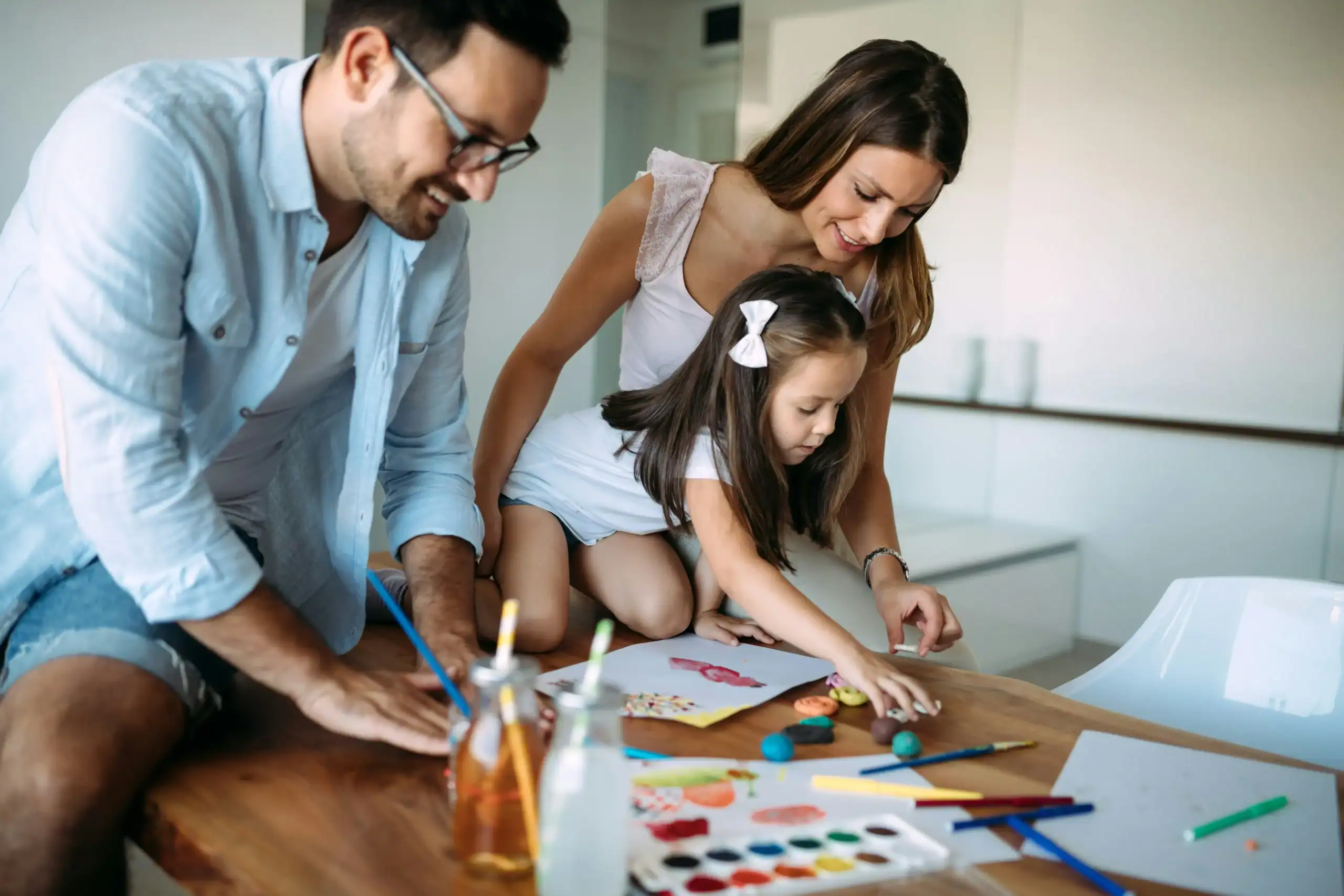 Parents encouraging their daughter through play and learning, building confidence for potty training special needs. Parents encouraging their daughter through play and learning, building confidence for potty training special needs.