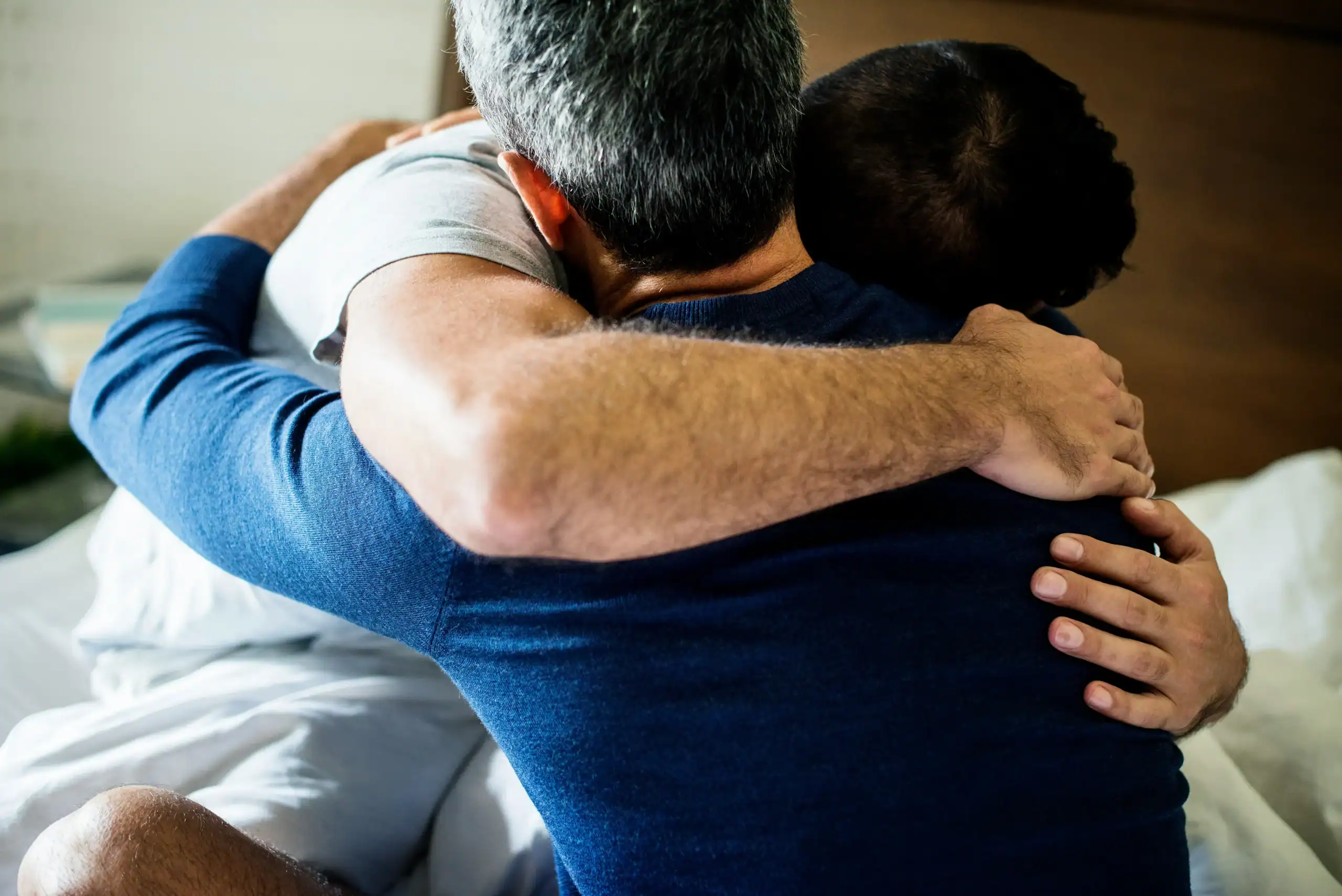 Supportive hug between two people, showing how to help someone facing what is social confusion. Supportive hug between two people, showing how to help someone facing what is social confusion.