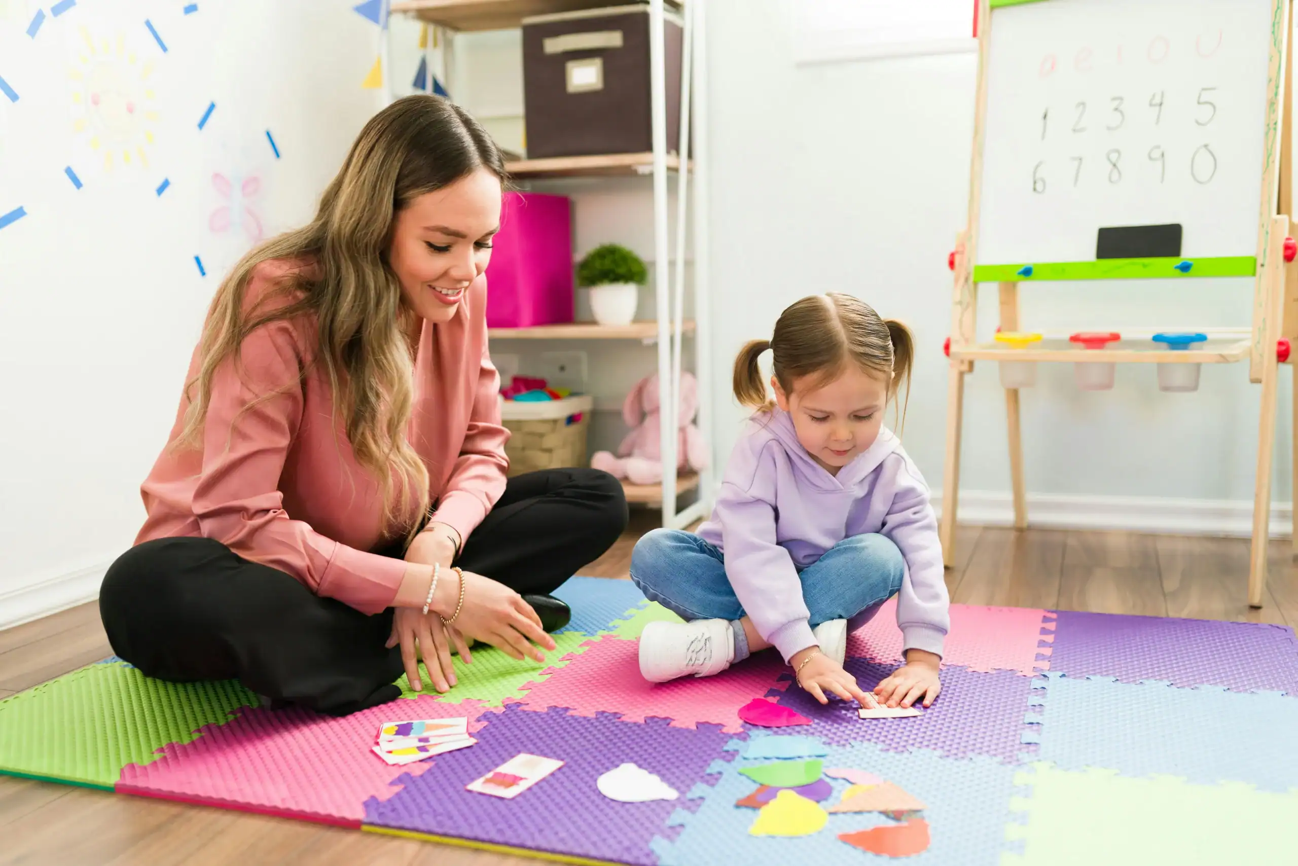 Child receiving hands-on learning support to help auditory dyslexia and language processing skills