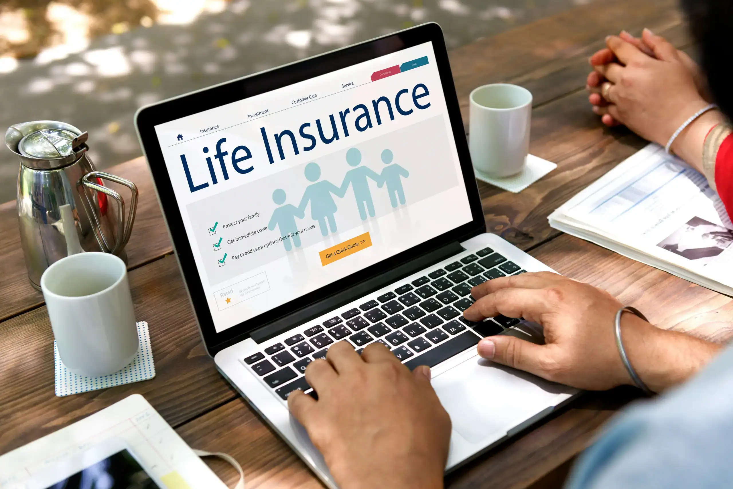 Photo of group term life insurance information displayed on laptop screen