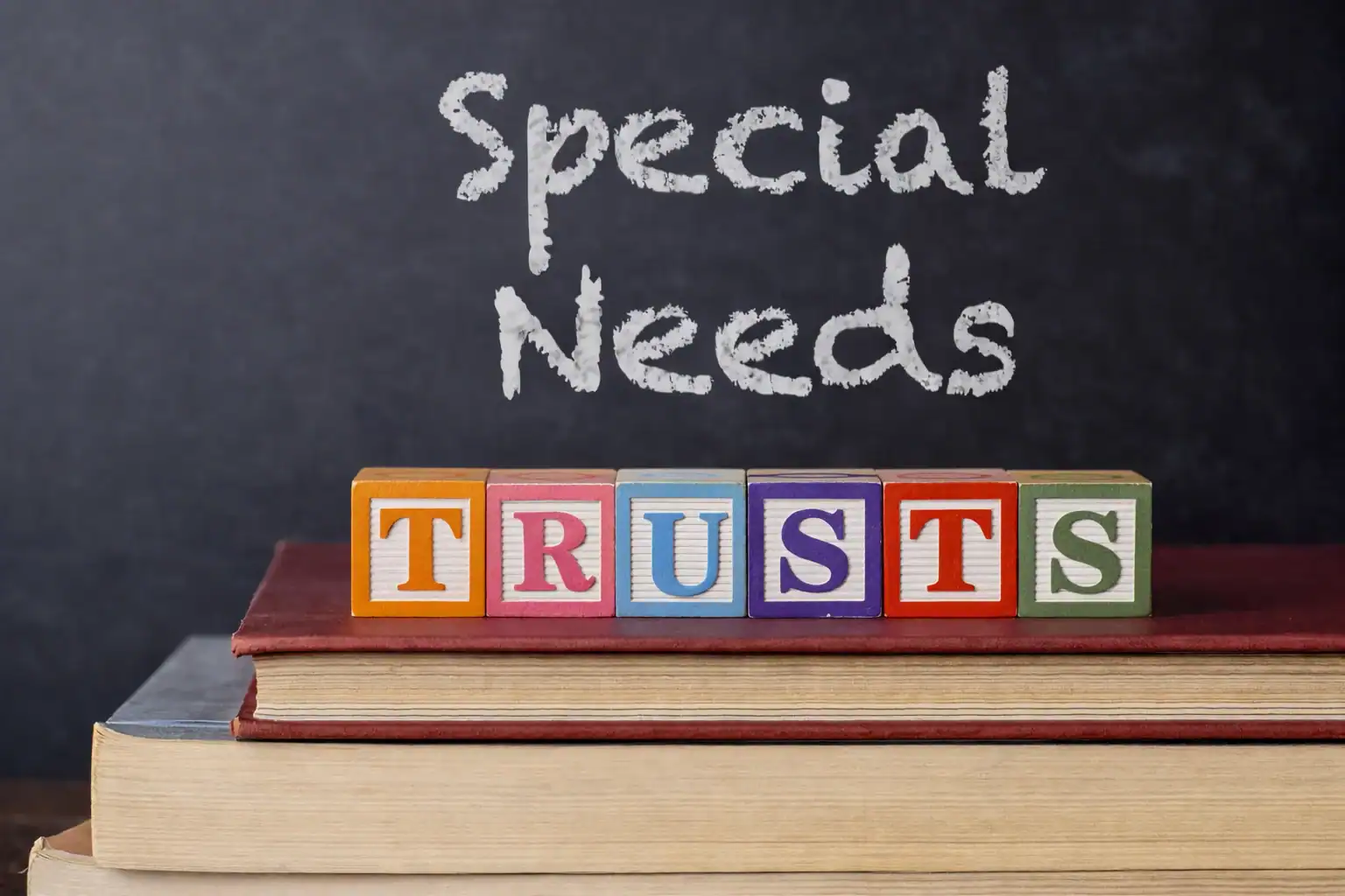 Types of special needs trusts shown with books and letter blocks highlighting legal planning Types of special needs trusts shown with books and letter blocks highlighting legal planning