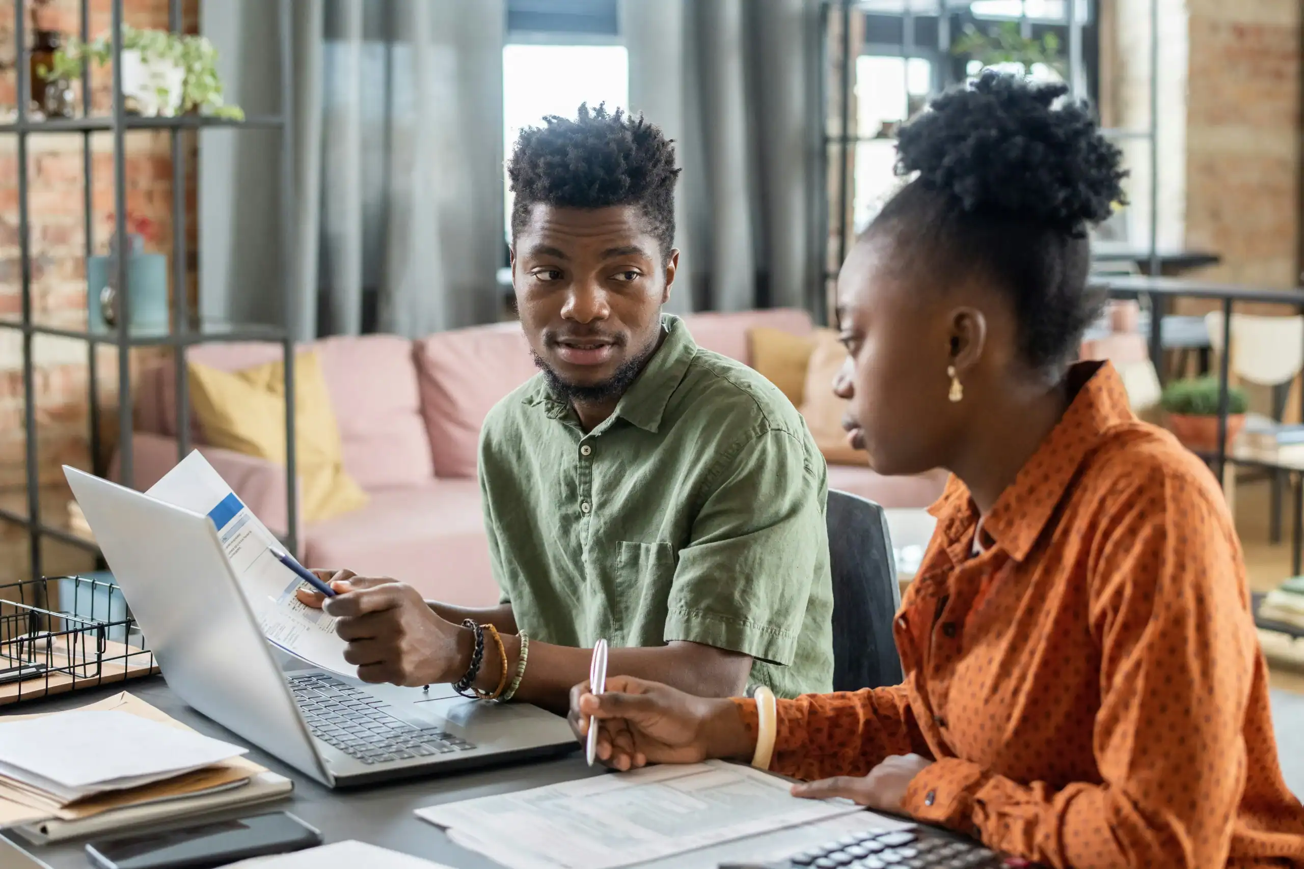 photo of couple budgeting together while evaluating life insurance for parents of special needs child