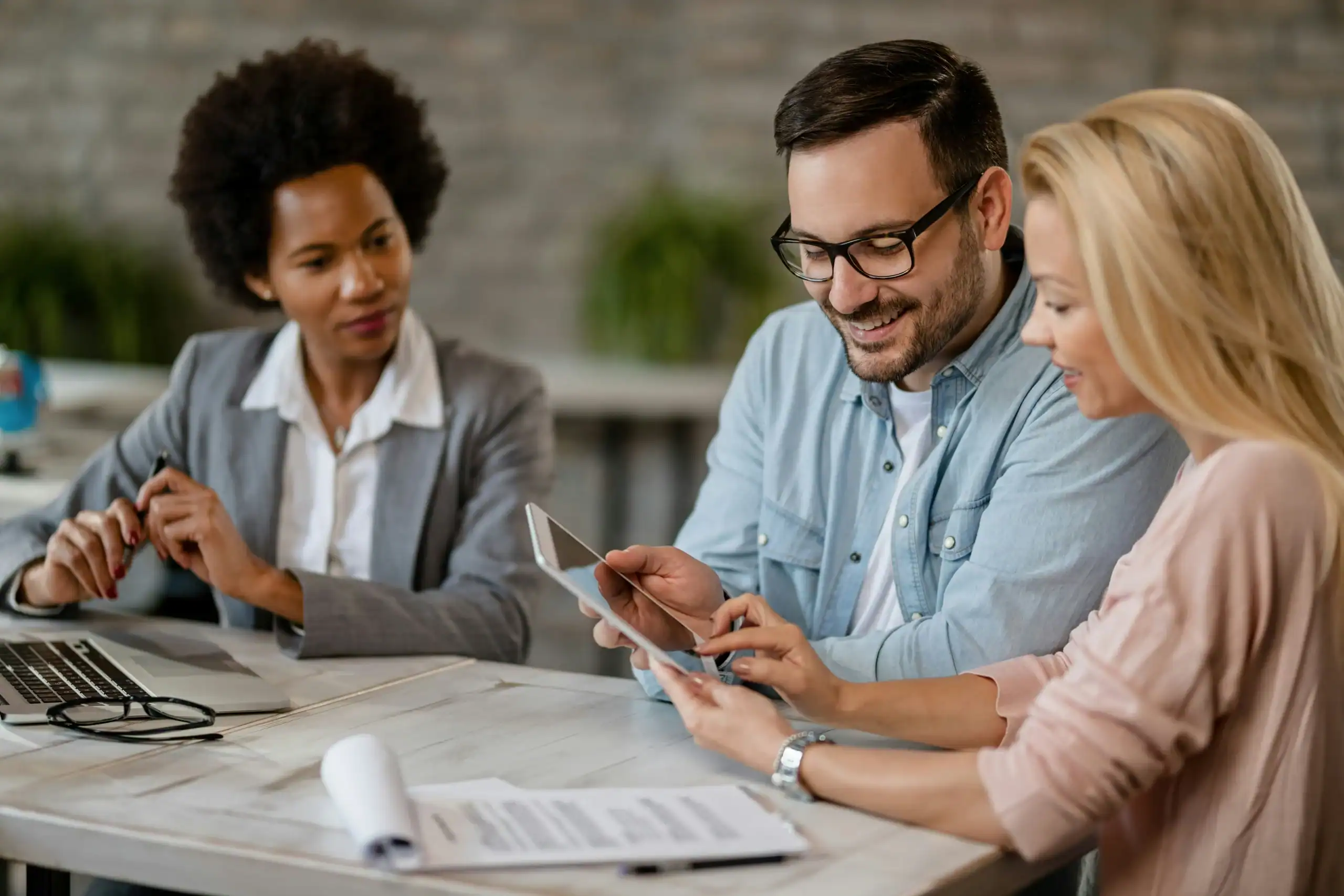 photo of couple reviewing finances with advisor while asking do I really need life insurance
